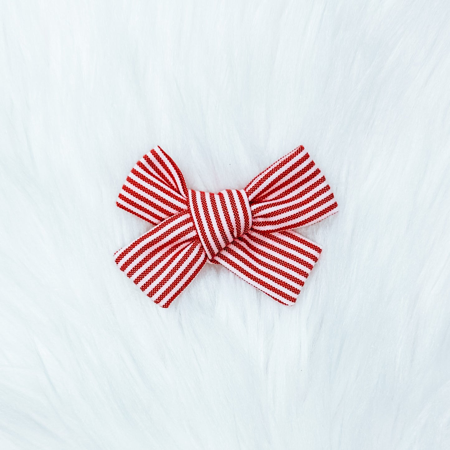 The “Red white and cutie” pinwheel style hair bow